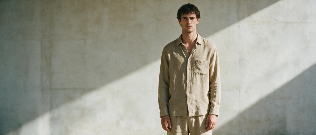 Later Than Usual hero banner, man in beige linen shirt